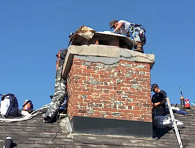 Gilbert Chimney Sweep installing a custom chimney crown in Gilbert, AZ