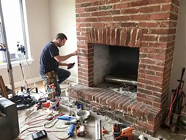 Gilbert Chimney Sweep specialist finalizing chimney liner service in Gilbert, AZ