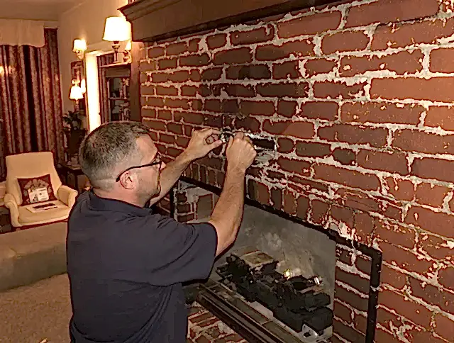 Gilbert Chimney Sweep expert fixing a fireplace in Gilbert, AZ